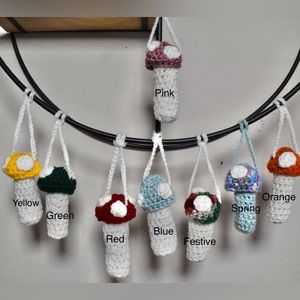 Crochet mushroom keychains/necklaces.